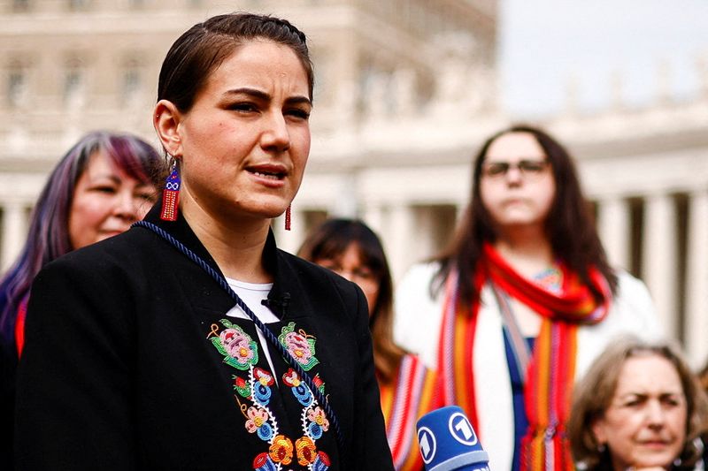 &copy; Reuters. Metis National Council president Cassidy Caron speaks to the media after meeting with Pope Francis near St. Peter's Square at the Vatican, March 28, 2022. REUTERS/Guglielmo Mangiapane