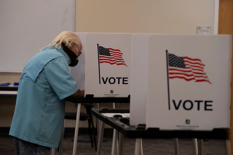 &copy; Reuters. FILE PHOTO: A voter casts his ballot at Dona Ana County Government Center during the New Mexico primary in Las Cruces, New Mexico, U.S., June 2, 2020.  REUTERS/Paul Ratje/File Photo