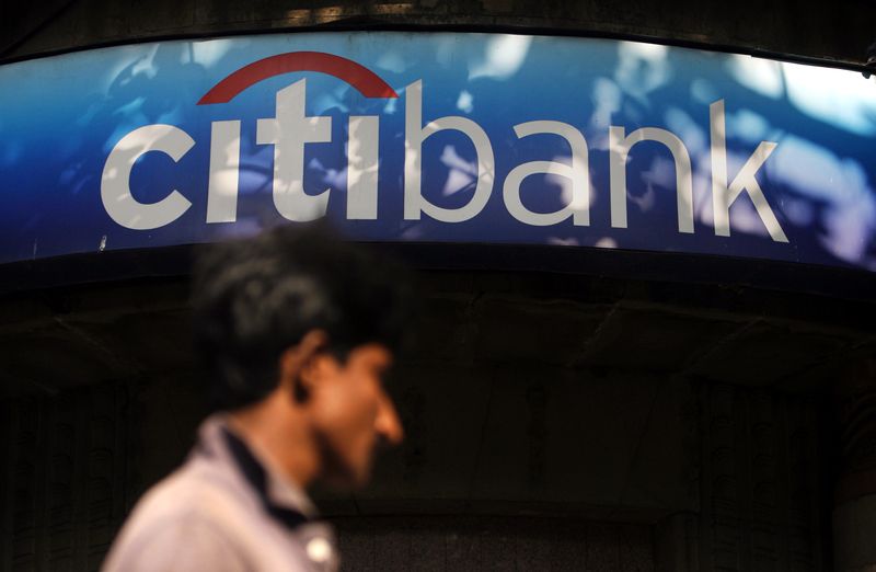 &copy; Reuters. FILE PHOTO: A man walks in front of a Citibank branch in Mumbai November 20, 2008. REUTERS/Arko Datta (INDIA)