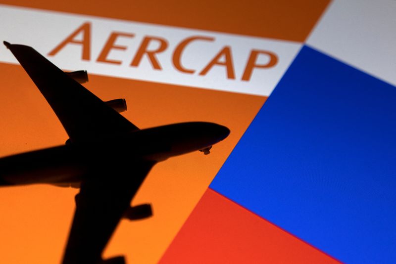 &copy; Reuters. A model airplane is placed on displayed AerCap logo next to Russian flag colors in this illustration taken February 28, 2022. REUTERS/Dado Ruvic/Illustration