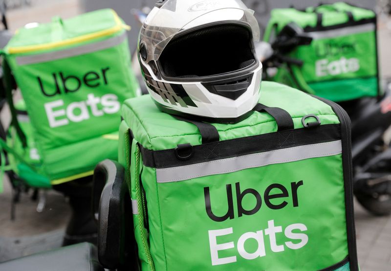 © Reuters. FILE PHOTO: Delivery bags with logos of Uber Eats are seen on a street amid the outbreak of the coronavirus disease (COVID-19) in central Kiev, Ukraine May 27, 2020.  REUTERS/Valentyn Ogirenko/File Photo