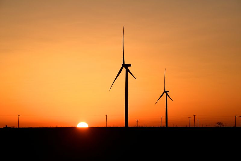 &copy; Reuters. FILE PHOTO: Wind turbines operate at sunrise in the Permian Basin oil and natural gas production area in Big Spring, Texas, U.S., February 12, 2019. REUTERS/Nick Oxford