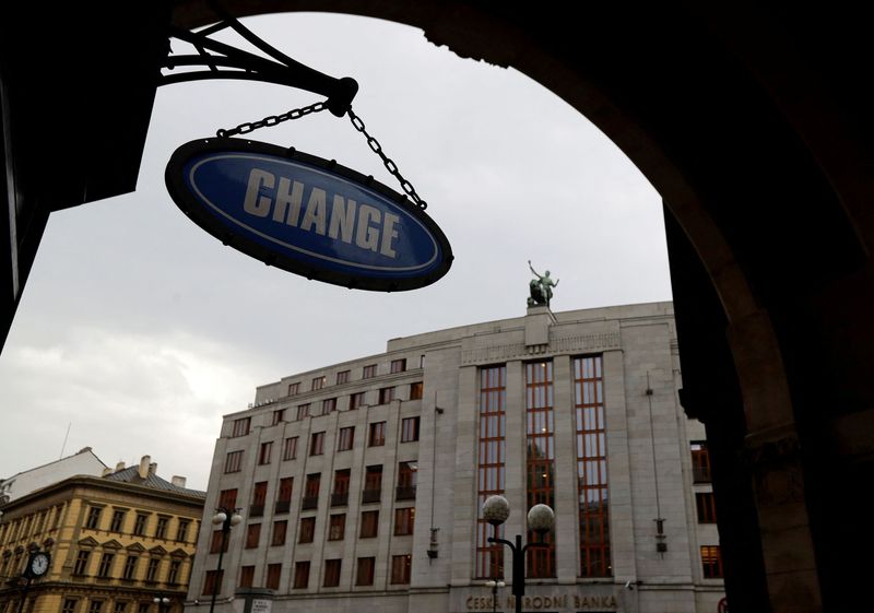 &copy; Reuters. FILE PHOTO: A sign of a currency exchange office hangs in front of the Czech National Bank in Prague, Czech Republic, August 3, 2017.   REUTERS/David W Cerny