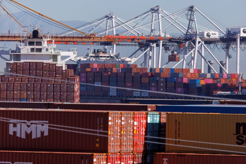 &copy; Reuters. Stacked containers are shown as ships unload their cargo at the Port of Los Angeles in Los Angeles, California, U.S. November 22, 2021. REUTERS/Mike Blake