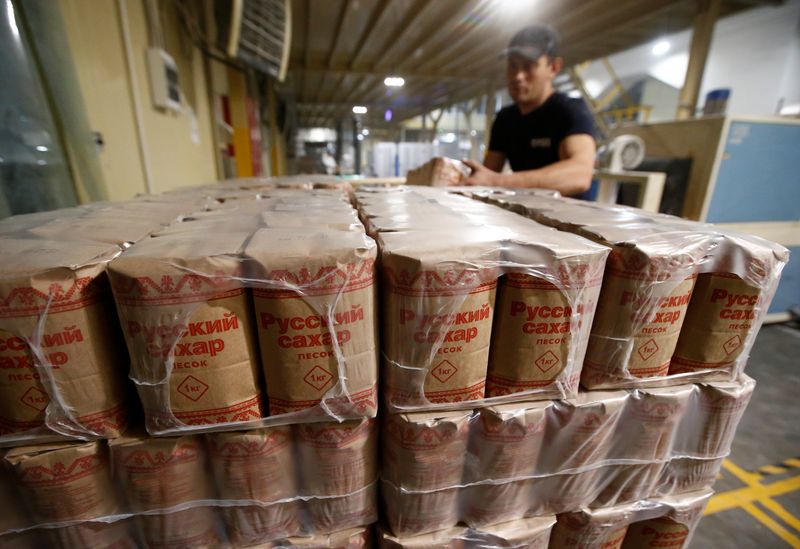 &copy; Reuters. An employee stocks packages with refined sugar at Znamensky Sugar Plant, owned by Russian farming conglomerate Rusagro (Ros Agro Plc), in the settlement of Znamenka, in Tambov region, Russia October 13, 2017.  REUTERS/Sergei Karpukhin