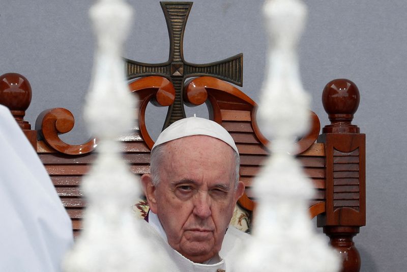 Pope fights foot pain in Malta, defends migrants