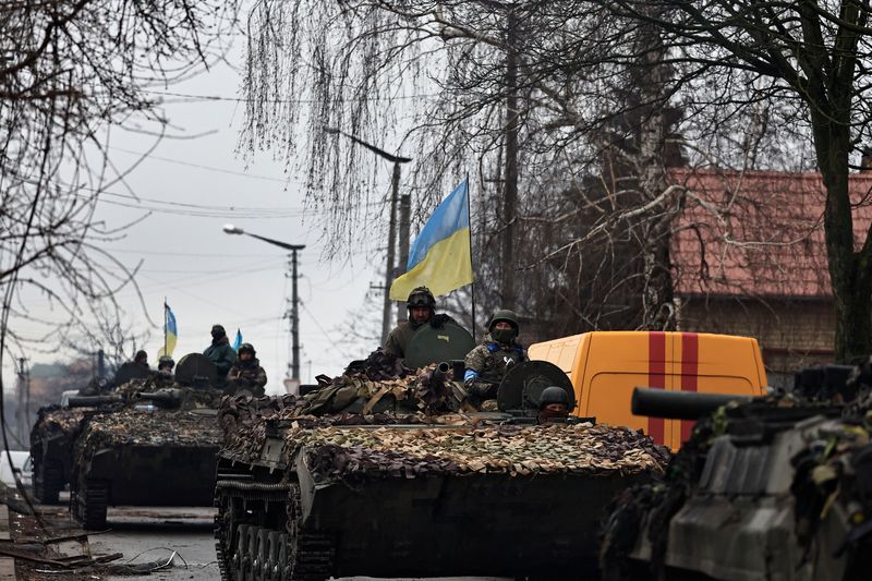 Ukrainian mayor shows dead bodies amid battle-scarred city of Bucha