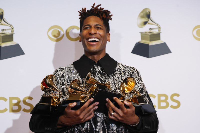 &copy; Reuters. Jon Batiste poses with their Grammys for Best American Roots Performance for "Cry," Album of the year for “We Are,” Best American roots song,  Best music video and Best score soundtrack for visual media for “Soul," at the 64th Annual Grammy Awards a
