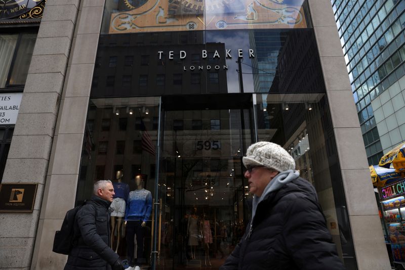 &copy; Reuters. FILE PHOTO: People walk by a Ted Baker store in Manhattan, New York City, New York, U.S., March 29, 2022. REUTERS/Andrew Kelly