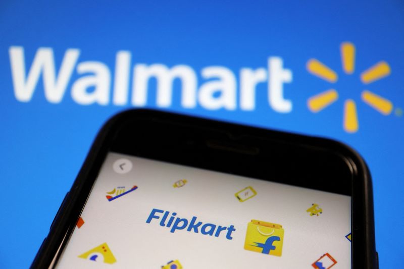 &copy; Reuters. FILE PHOTO: A mobile phone showing an image of Indian online retailer Flipkart is seen in front of a Walmart Inc logo displayed in this illustration picture taken July 14, 2021. REUTERS/Florence Lo/Illustration