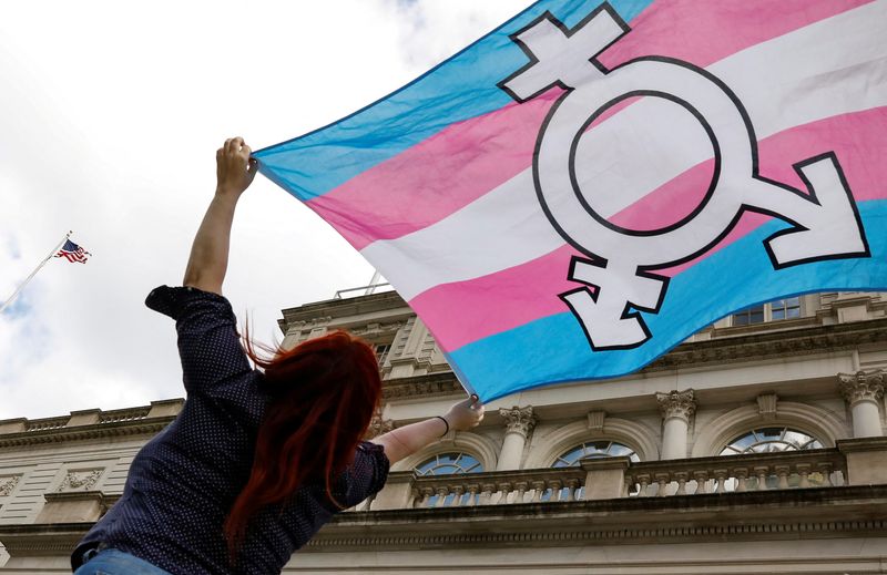 &copy; Reuters. FILE PHOTO: A person holds up a flag during rally to protest the Trump administration's reported transgender proposal to narrow the definition of gender to male or female at birth, at City Hall in New York City, U.S., October 24, 2018. REUTERS/Brendan McD