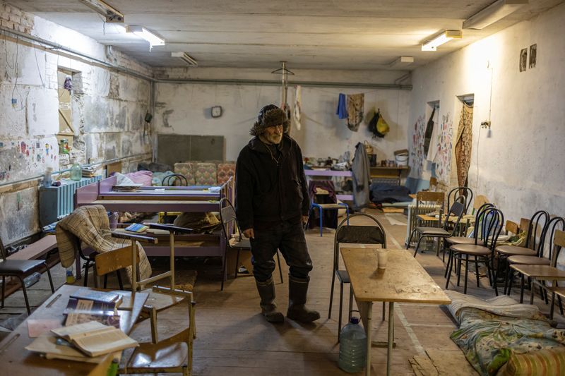 Ukrainian villagers count dead after weeks of being held in a school basement