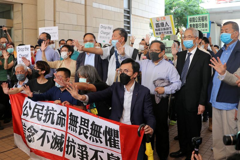 &copy; Reuters. FILE PHOTO: Pro-democracy activists chant slogans outside the West Kowloon Magistrates Court, in Hong Kong, China May 18, 2020. REUTERS/Jessie Pang/File Photo