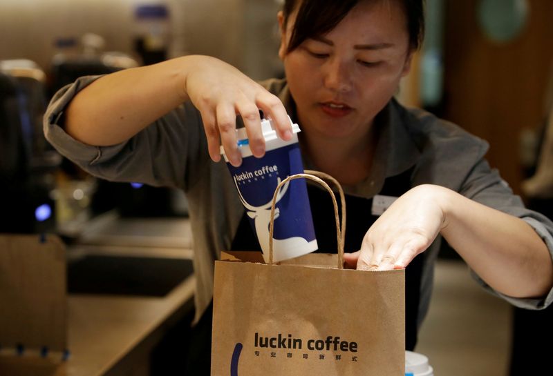 &copy; Reuters. FILE PHOTO: A barista packs a coffee at a Luckin Coffee store in Beijing, China July 17, 2018. Picture taken July 17, 2018. REUTERS/Jason Lee/File Photo