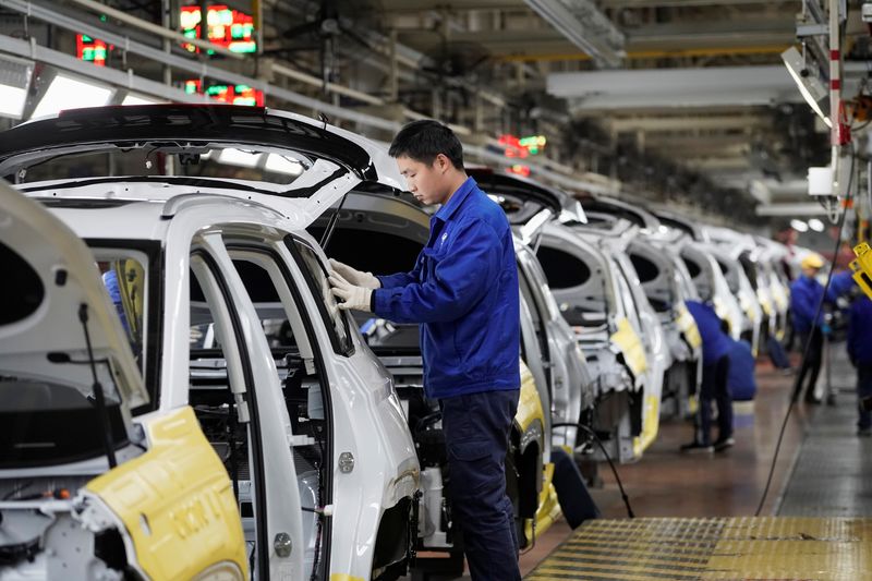 &copy; Reuters. FILE PHOTO: Employees work at a final assembly plant operated by General Motors Co and its local joint-venture partners in Liuzhou, Guangxi Zhuang Autonomous Region, China, February 28, 2019. REUTERS/Aly Song/File Photo