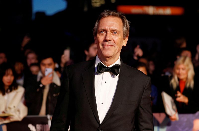 &copy; Reuters. FILE PHOTO: Actor Hugh Laurie poses as he arrives to attend the European premiere of "The Personal History of David Copperfield" in the BFI London Film Festival 2019, in London, Britain October 2, 2019. REUTERS/Peter Nicholls