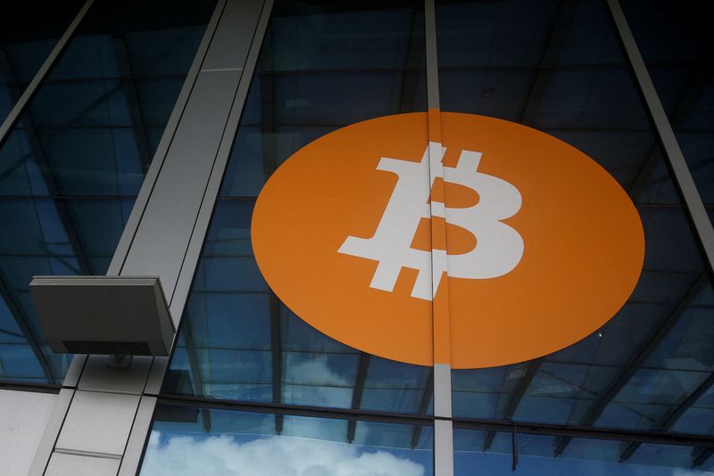 &copy; Reuters. FILE PHOTO: A bitcoin logo is seen at the entrance of the Miami Beach Convention Center during the Bitcoin Conference 2022 in Miami Beach, Florida, U.S. April 6, 2022. REUTERS/Marco Bello