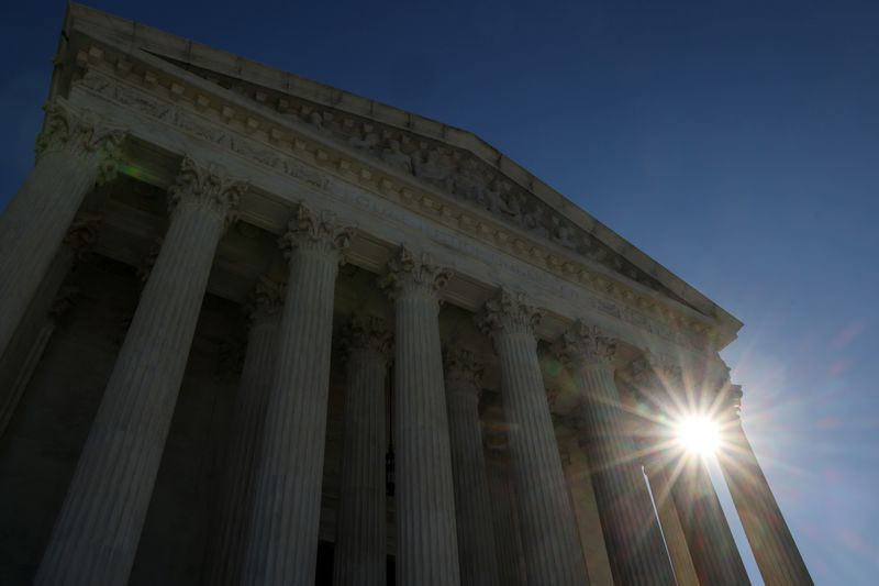 &copy; Reuters. FILE PHOTO: The sun rises behind the U.S. Supreme Court building the day after Election Day as results are still being counted and election-related lawsuits are expected to make their way through the court system in Washington, U.S. November 4, 2020.  REU