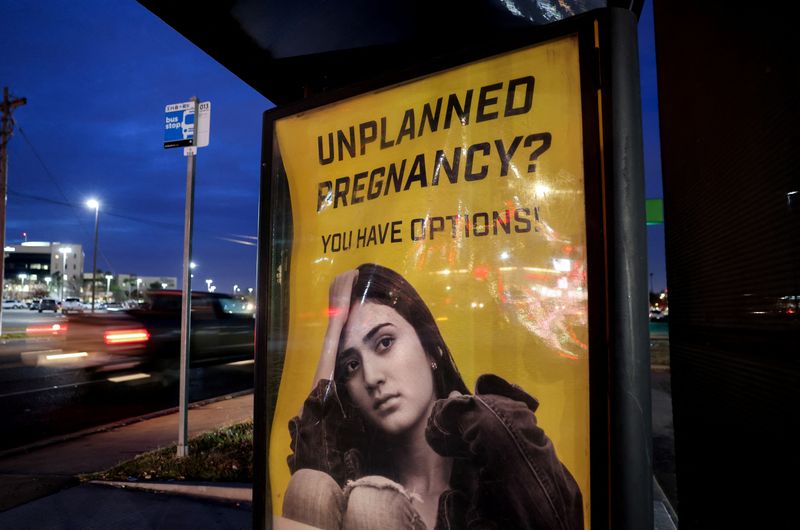 &copy; Reuters. FILE PHOTO: A billboard advertising adoption services targets pregnant women at a bus stop in Oklahoma City, Oklahoma, U.S., December 7, 2021.   REUTERS/Evelyn Hockstein