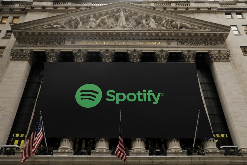 &copy; Reuters. FILE PHOTO: The Spotify logo hangs on the facade of the New York Stock Exchange as the company lists its stock with a direct listing in New York, U.S., April 3, 2018. REUTERS/Lucas Jackson/File Photo