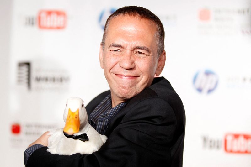 &copy; Reuters. FILE PHOTO: Comedian Gilbert Gottfried arrives with a duck at the Webby Awards in New York June 14, 2010. REUTERS/Lucas Jackson