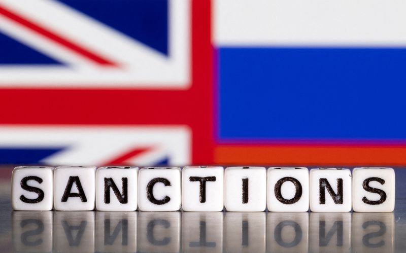 &copy; Reuters. FILE PHOTO: Plastic letters arranged to read "Sanctions" are placed in front the Union Jack and Russian flag colors in this illustration taken February 28, 2022. REUTERS/Dado Ruvic/Illustration