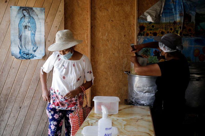 &copy; Reuters. A woman is attended to in a soup kitchen in Pamplona Alta, a low-income neighbourhood on the outskirts of the Peruvian capital where soaring food prices are placing animal proteins out of reach for the most vulnerable residents, in Lima, Peru April 11, 20