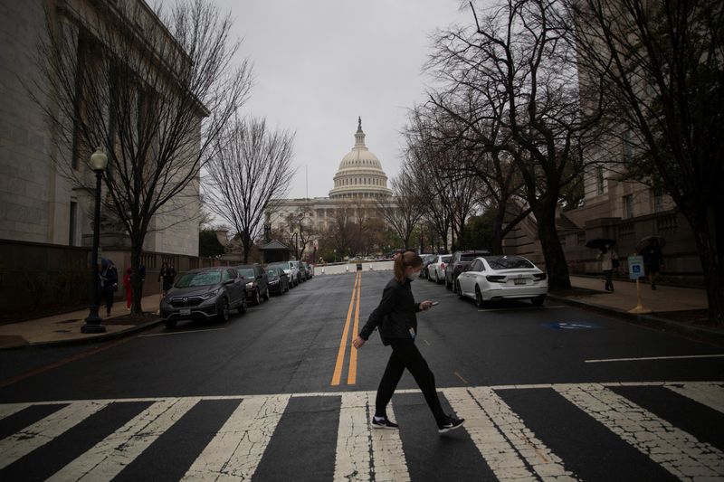 &copy; Reuters. A visitor uses a crosswalk near the Longworth House Office Building on Capitol Hill in Washington, U.S., April 6, 2022. REUTERS/Tom Brenner/File Photo