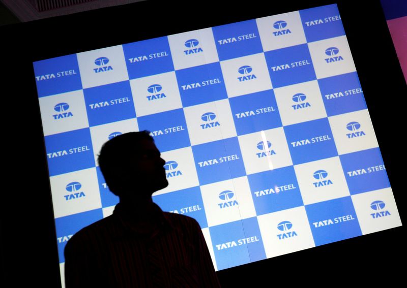 © Reuters. A man walks past a screen displaying Tata Steel logo before the start of a news conference in Mumbai, India May 25, 2016. REUTERS/Danish Siddiqui/Files