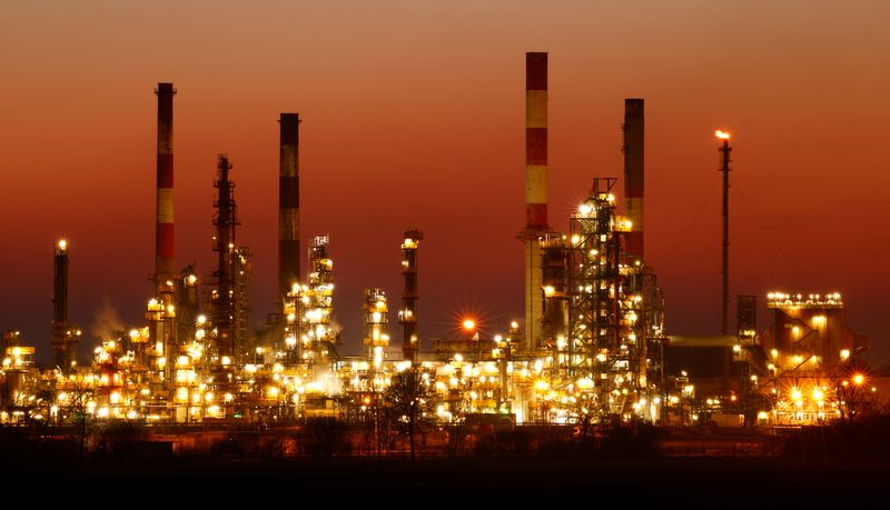 &copy; Reuters. The chimneys of the Total Grandpuits oil refinery are seen just after sunset, southeast of Paris, France, March 1, 2021.  REUTERS/Christian Hartmann