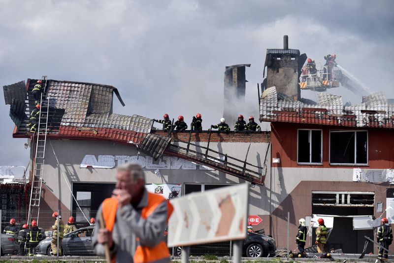 &copy; Reuters. Firefighters work at the site of military strikes on buildings as Russia's attack on Ukraine continues, in Lviv, Ukraine April 18, 2022. REUTERS/Pavlo Palamarchuk