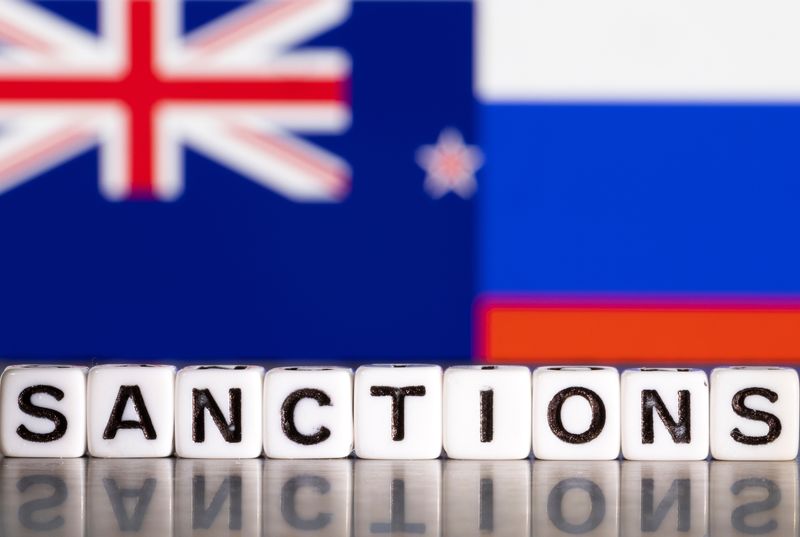 &copy; Reuters. Plastic letters arranged to read "Sanctions" are placed in front the flag colors of New Zealand and Russia in this illustration taken February 28, 2022. REUTERS/Dado Ruvic/Illustration