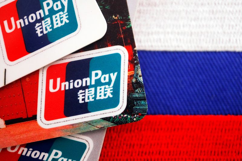 &copy; Reuters. FILE PHOTO: UnionPay cards are seen displayed with a Russian flag in this illustration picture taken March 7, 2022. REUTERS/Florence Lo/Illustration