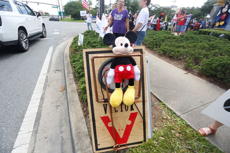 &copy; Reuters. FILE PHOTO: A Mickey Mouse doll is seen pinned depicting a large mouse trap while supporters of Florida's Republican-backed "Don't Say Gay" bill that bans classroom instruction on sexual orientation and gender identity for many young students gather for a