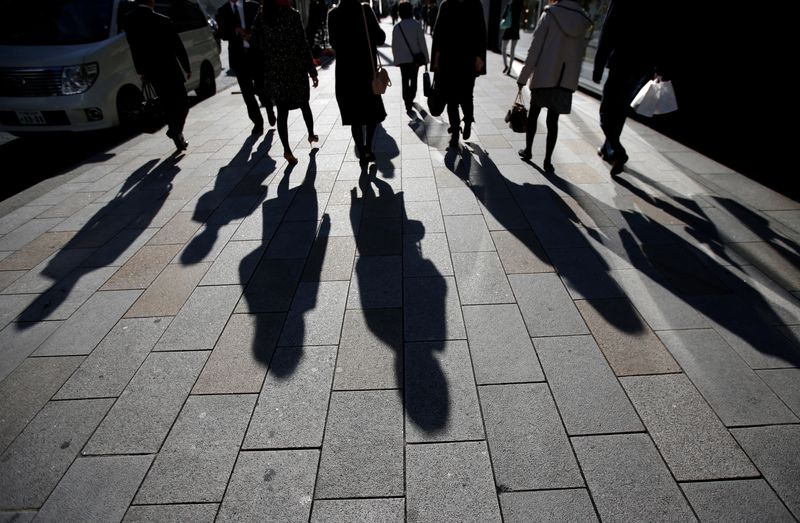 &copy; Reuters. FILE PHOTO: The shadows of pedestrians are pictured cast on a street in Tokyo, Japan, November 27, 2014.   REUTERS/Issei Kato