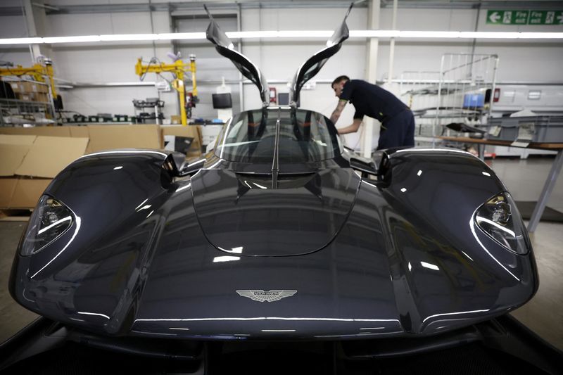 &copy; Reuters. An employee works on the interior of an Aston Martin Valkyrie car at the company’s factory in Gaydon, Britain, March 16, 2022. REUTERS/Phil Noble
