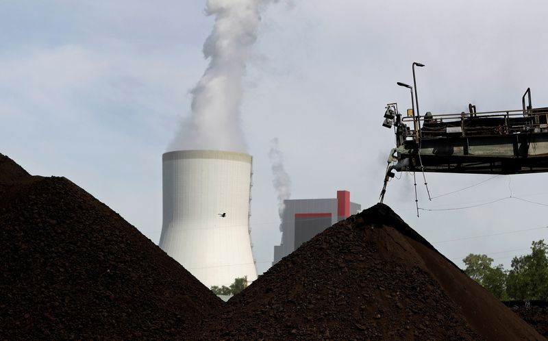 &copy; Reuters. FILE PHOTO: A cooling tower from the Turow coal-fired power plant is seen near the Turow open-pit coal mine operated by the company PGE in Bogatynia, Poland, June 15, 2021. REUTERS/David W Cerny/File Photo