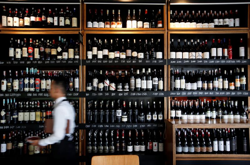 &copy; Reuters. FILE PHOTO: A server passes a wine rack at the Cork & Screw restaurant in Jakarta, Indonesia, October 20, 2018. REUTERS/Willy Kurniawan/File Photo