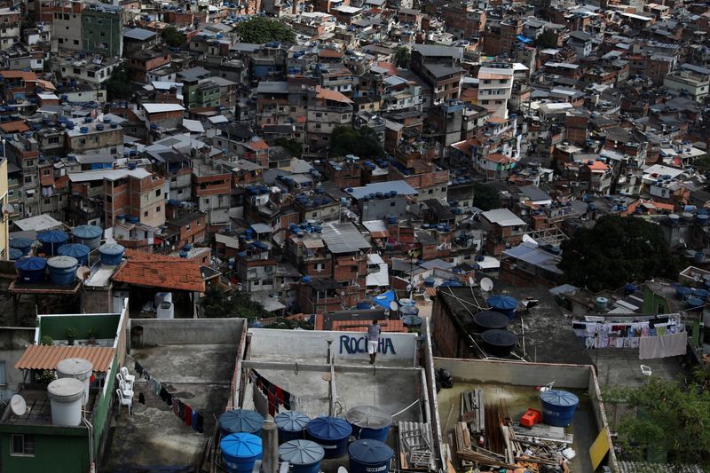 &copy; Reuters. FILE PHOTO: A man looks on over the Rocinha slum from the roof of his house in Rio de Janeiro, Brazil October 13, 2021. REUTERS/Pilar Olivares/File Photo