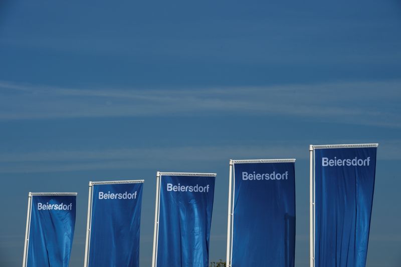 &copy; Reuters. FILE PHOTO: Flags of German personal-care company Beiersdorf are pictured at the annual shareholders meeting in Hamburg, Germany April 20, 2017. REUTERS/Fabian Bimmer