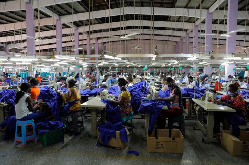 &copy; Reuters. FILE PHOTO: Workers of a local factory begin the production of personal protective gear for local frontline health workers as commissioned by the government, during the partial lockdown in Accra to slow the spread of the coronavirus disease (COVID-19), in