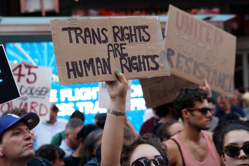&copy; Reuters. FILE PHOTO: People protest U.S. President Donald Trump's announcement that he plans to reinstate a ban on transgender individuals from serving in any capacity in the U.S. military, in Times Square, in New York City, New York, U.S., July 26, 2017. REUTERS/