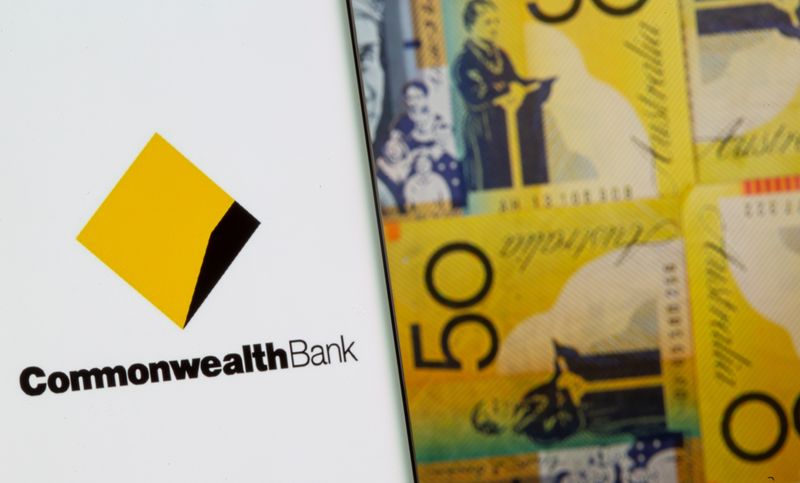 &copy; Reuters. Commonwealth Bank logo is seen on a smartphone in front of displayed Australian dollar banknotes in this illustration taken, November 8, 2021. REUTERS/Dado Ruvic/Illustration