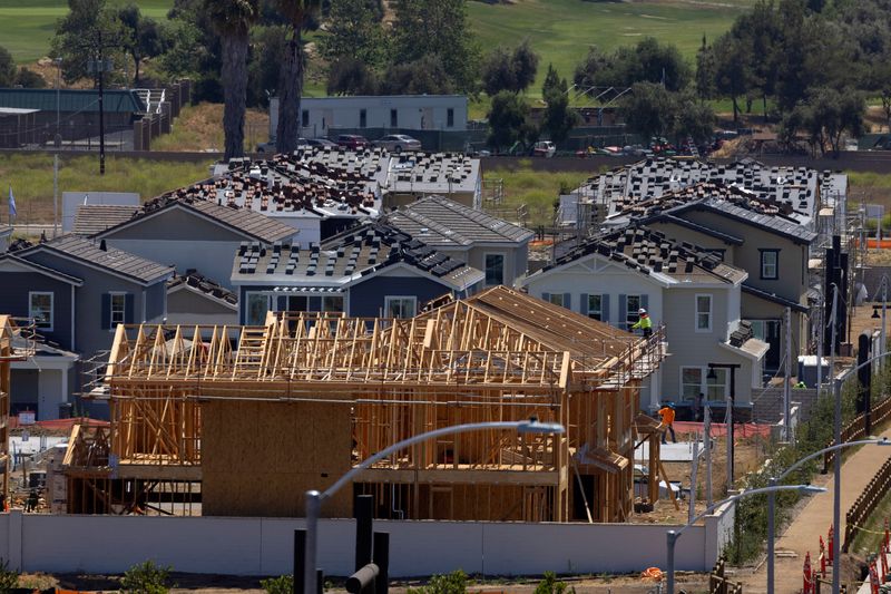 © Reuters. Residential single family homes construction by KB Home are shown under construction in the community of Valley Center, California, U.S. June 3, 2021.   REUTERS/Mike Blake