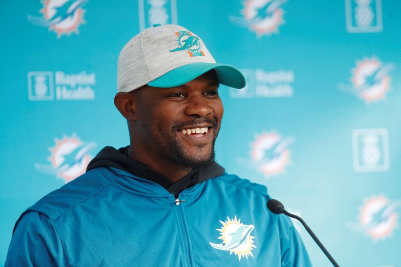 &copy; Reuters. FILE PHOTO: American Football - NFL - Miami Dolphins Media Day - Hanbury Manor Marriott Hotel & Country Club, Ware, Britain - October 15, 2021 Miami Dolphins' Brian Flores during a press conference REUTERS/Paul Childs/