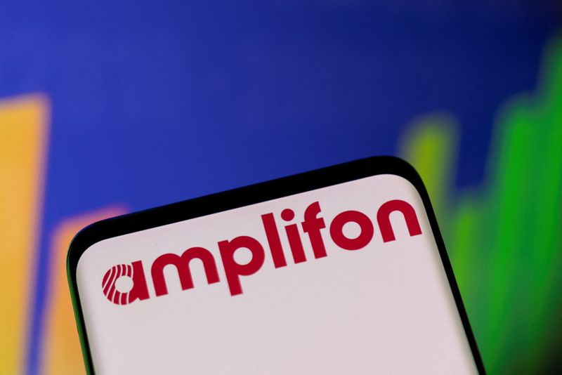 &copy; Reuters. Amplifon logo and stock graph are seen in this illustration taken, May 1, 2022. REUTERS/Dado Ruvic/Illustration