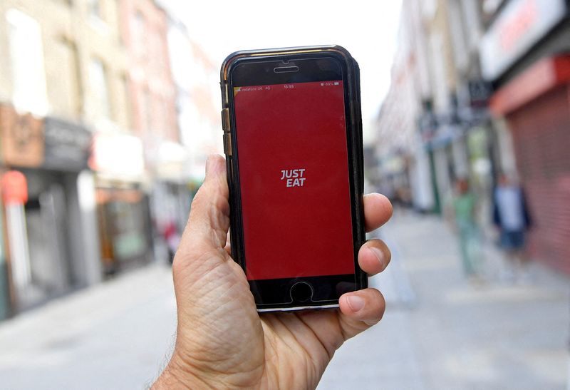 &copy; Reuters. FILE PHOTO: The app for Just Eat is displayed on a smartphone in this posed picture in London, Britain, August 5, 2019. REUTERS/Toby Melville