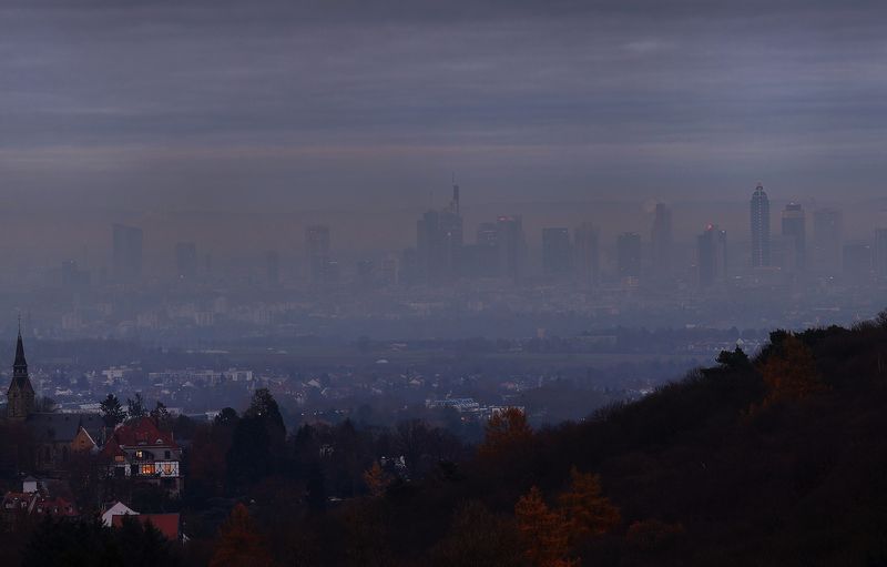 &copy; Reuters. FILE PHOTO: A house is illuminated in front of the skyline of Frankfurt as the spread of the coronavirus disease (COVID-19) continues during a foggy morning in Kronberg, Germany, November 24, 2021.  REUTERS/Kai Pfaffenbach
