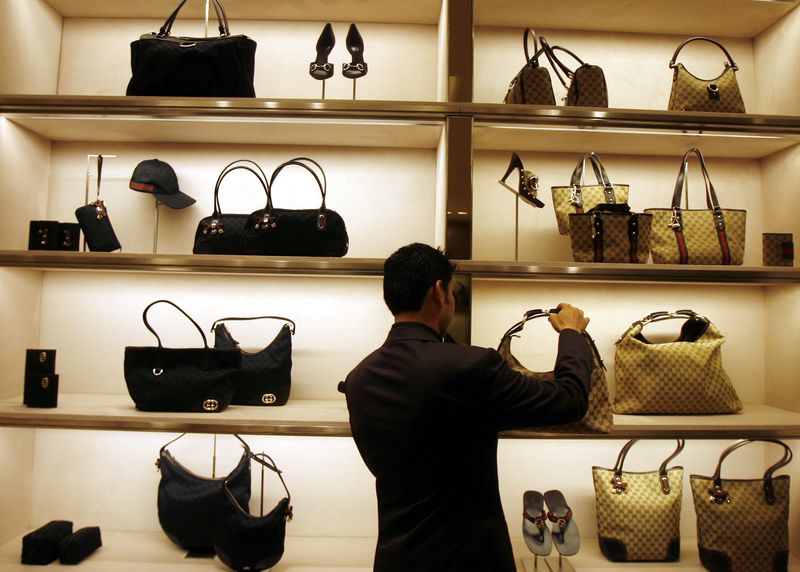 &copy; Reuters. FILE PHOTO: An employee arranges bags at a Gucci showroom in Mumbai November 25, 2008. REUTERS/Arko Datta