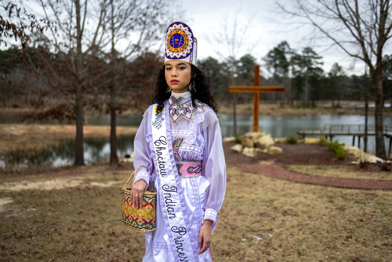 &copy; Reuters. FILE PHOTO: Choctaw Indian Princess Shemah Crosby poses for a photo at Lake Pushmataha where the Mississippi Band of Choctaw Indians erected a COVID-19 memorial in March of 2021. Shemah lost her grandmother, Lena Denson, due to COVID-19. Denson was a form
